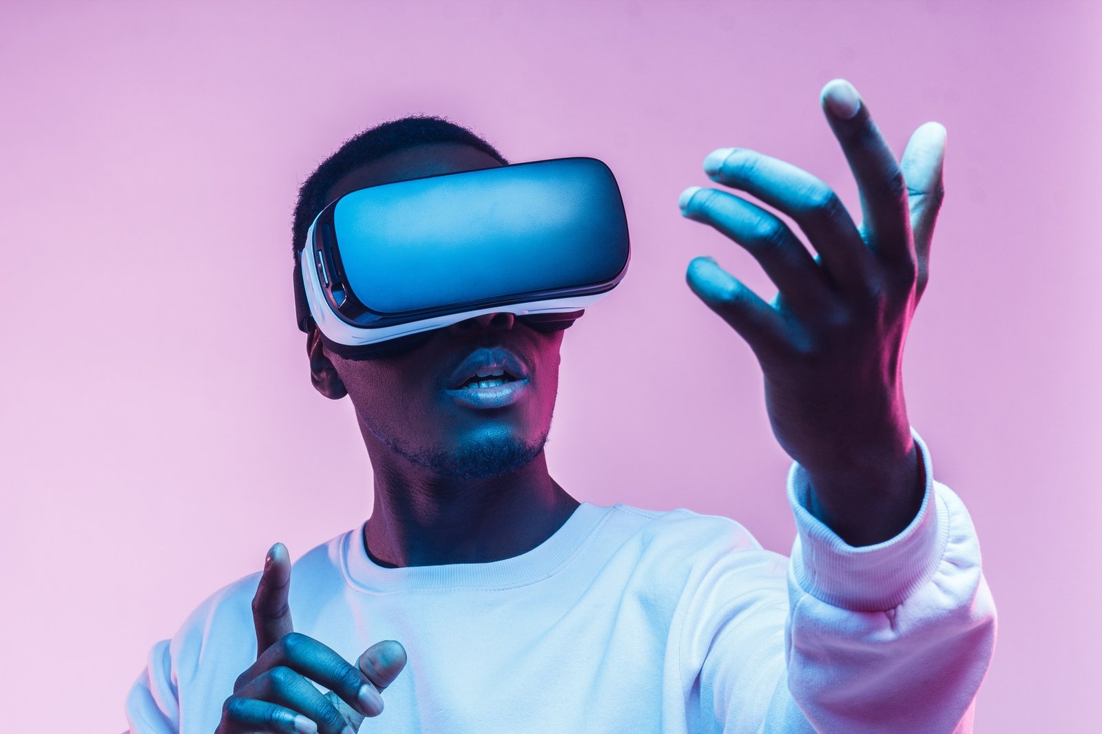 Young african american man playing game using VR glasses, enjoying 360 degree virtual reality